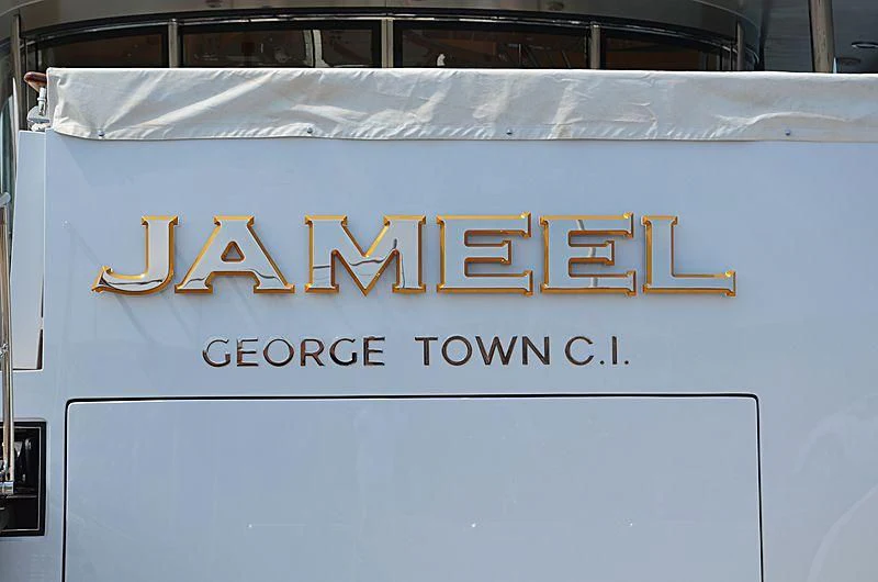 a white car with a yellow license plate aboard JAMEEL Yacht for Sale