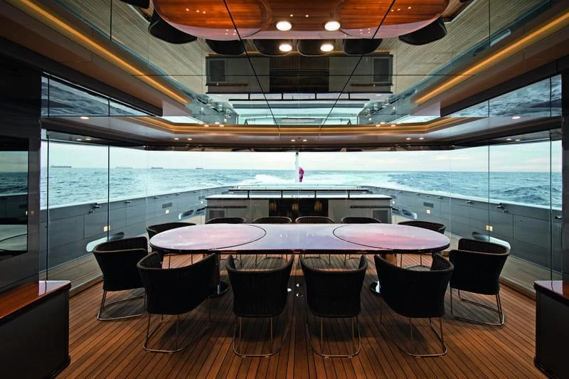 a restaurant with a table and chairs aboard SILVER FAST Yacht for Sale