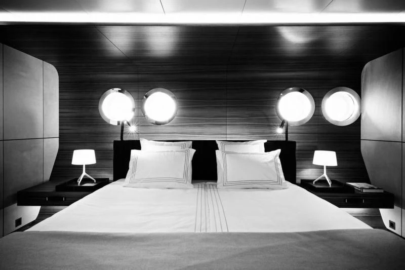 a bed with lamps on either side aboard SILVER FAST Yacht for Sale