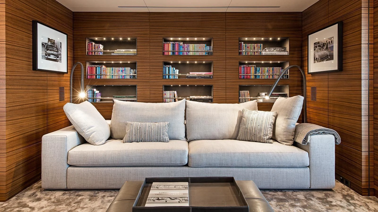 a living room with a couch and a book shelf aboard SILVER FAST Yacht for Sale