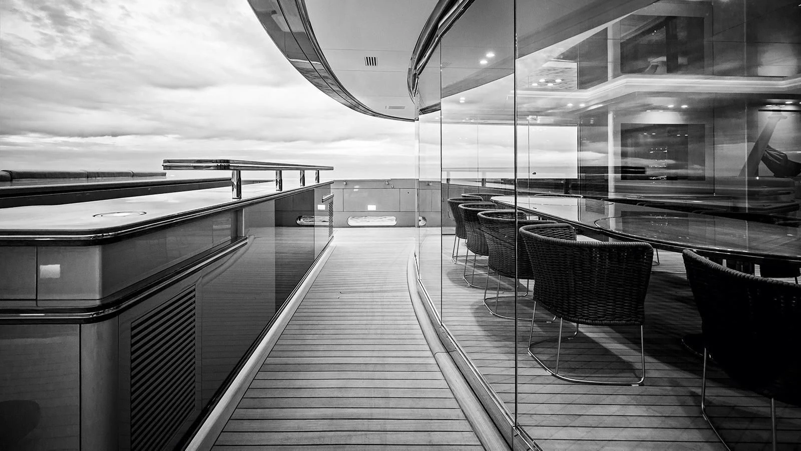 a deck with chairs and a railing aboard SILVER FAST Yacht for Sale