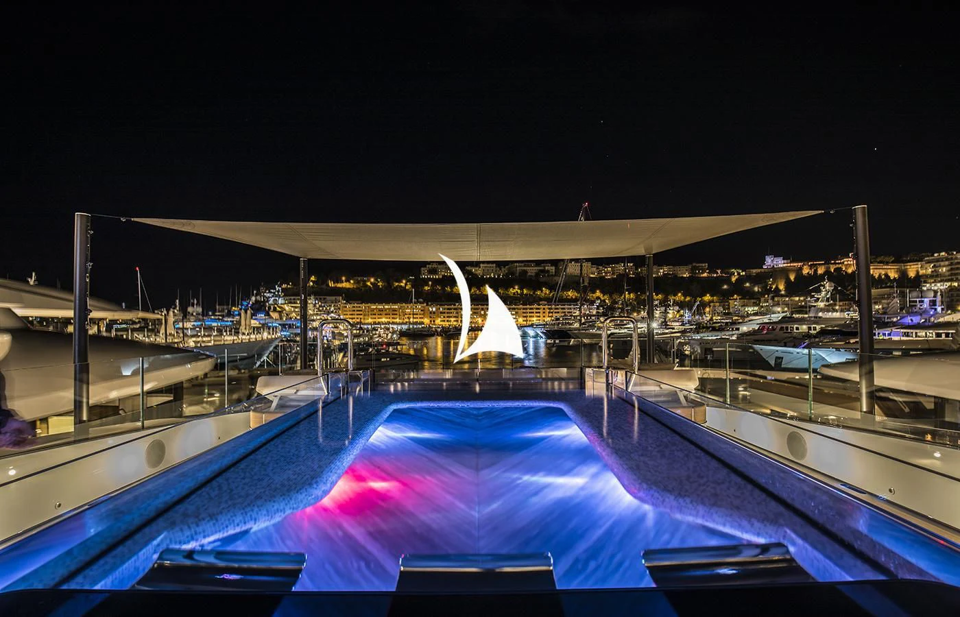a large pool with a large white dome and a large building in the background aboard SEVERIN°S Yacht for Charter