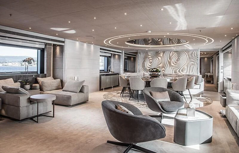 a large living room with a large chandelier aboard SEVERIN°S Yacht for Charter