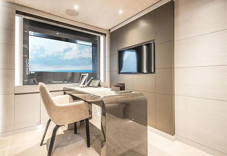 a room with a table and a tv aboard SEVERIN°S Yacht for Charter