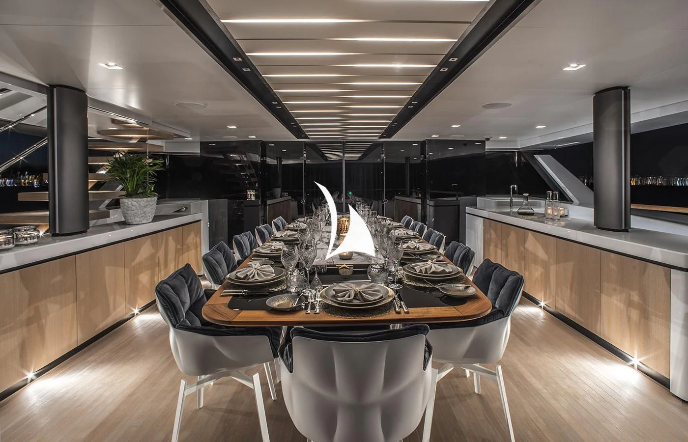 a large table with chairs around it aboard SEVERIN°S Yacht for Charter