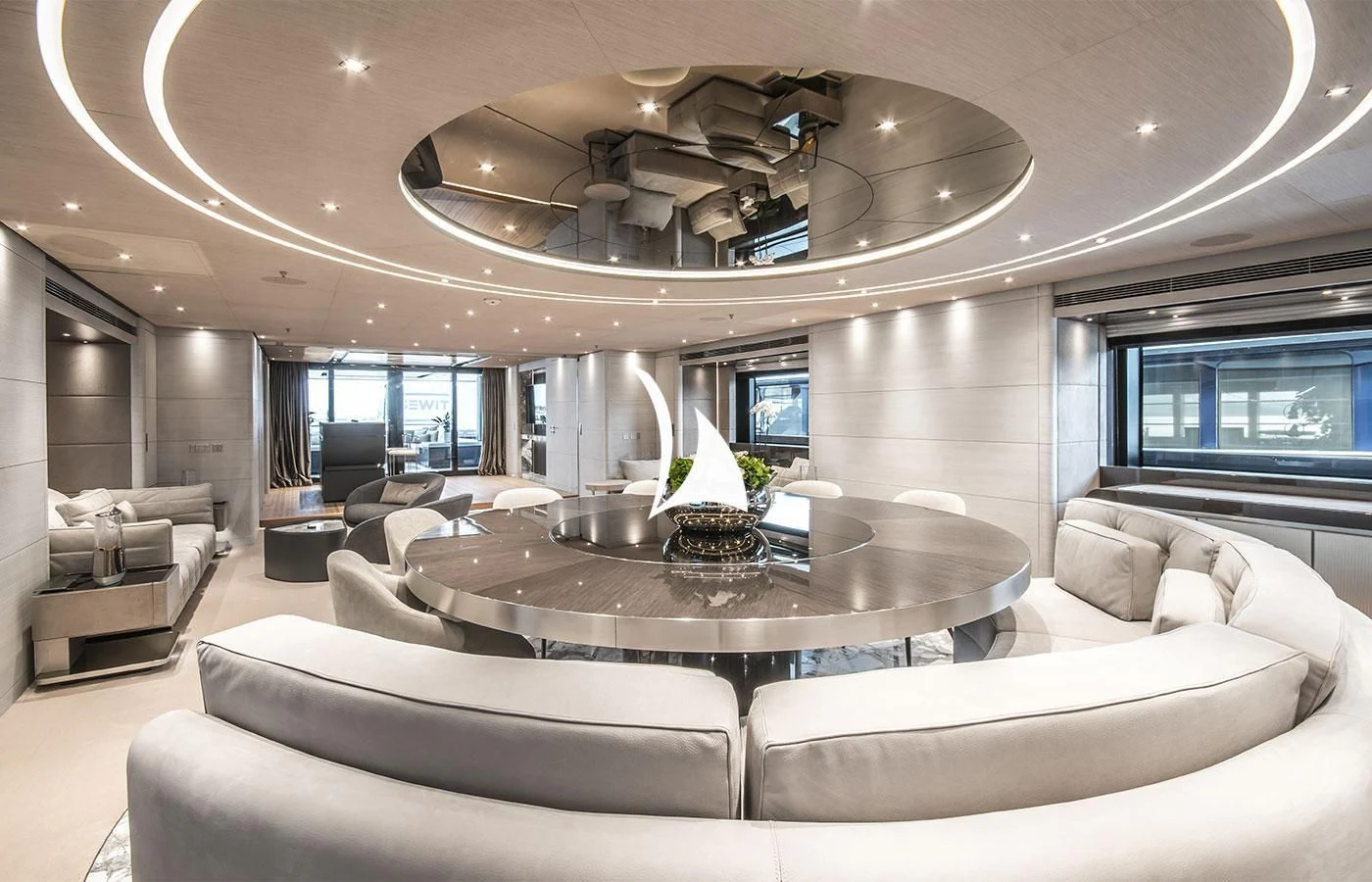 a living room with a large chandelier aboard SEVERIN°S Yacht for Charter