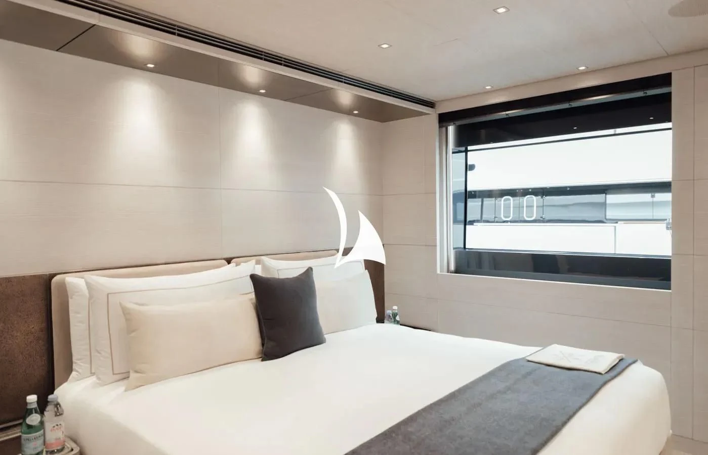 a bed with white sheets and pillows aboard SEVERIN°S Yacht for Charter