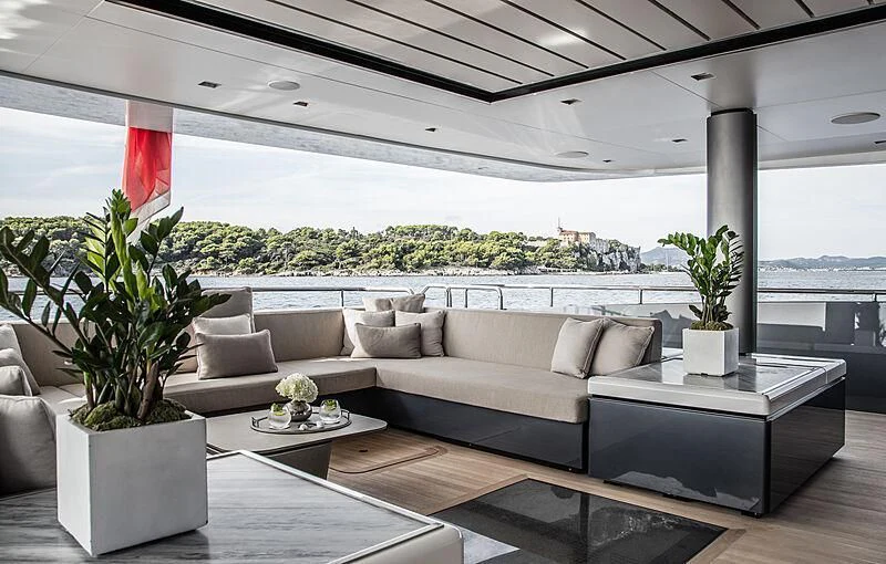 a living room with a couch and a table aboard SEVERIN°S Yacht for Charter