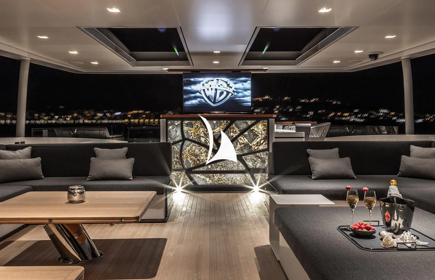 a room with a couch and a table and a tv aboard SEVERIN°S Yacht for Charter