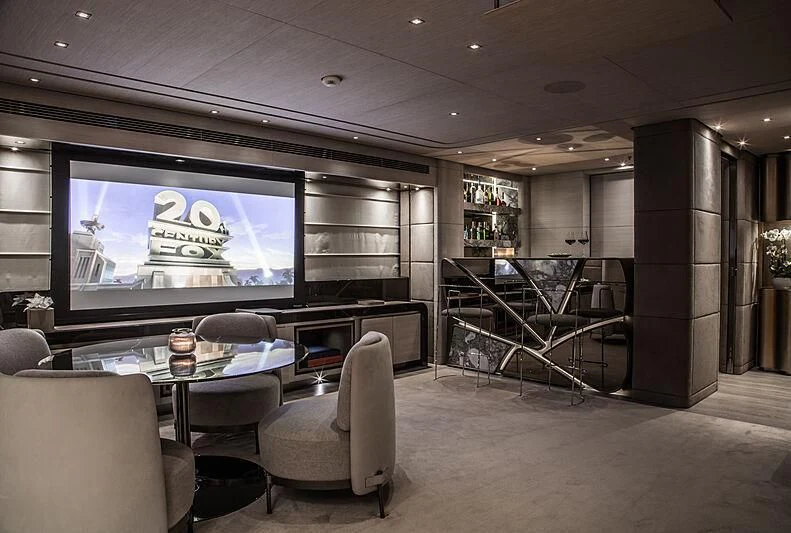 a room with a table chairs and a tv aboard SEVERIN°S Yacht for Charter
