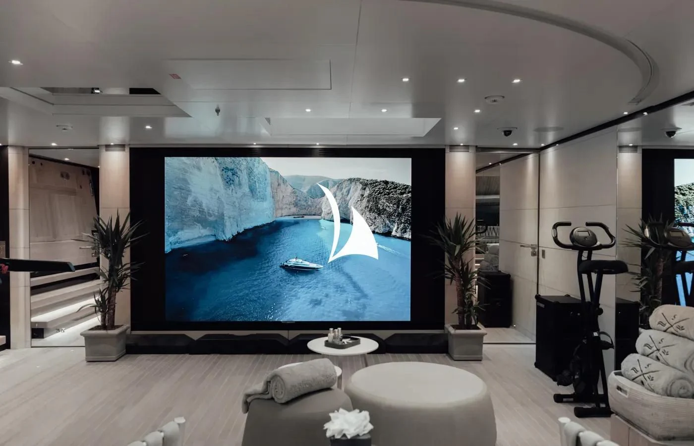 a large blue screen in a living room aboard SEVERIN°S Yacht for Charter
