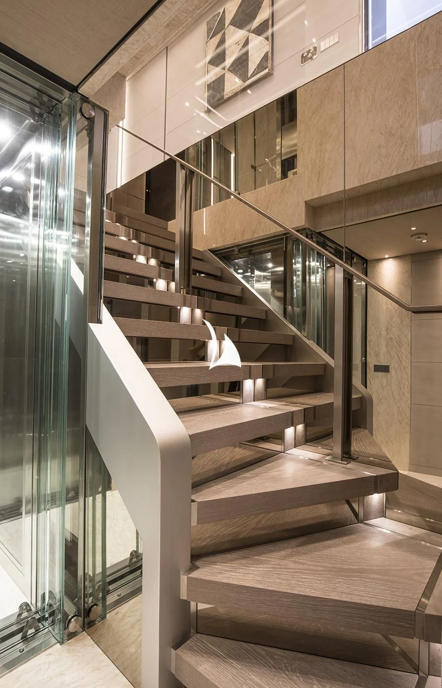 a staircase with a glass wall aboard SEVERIN°S Yacht for Charter