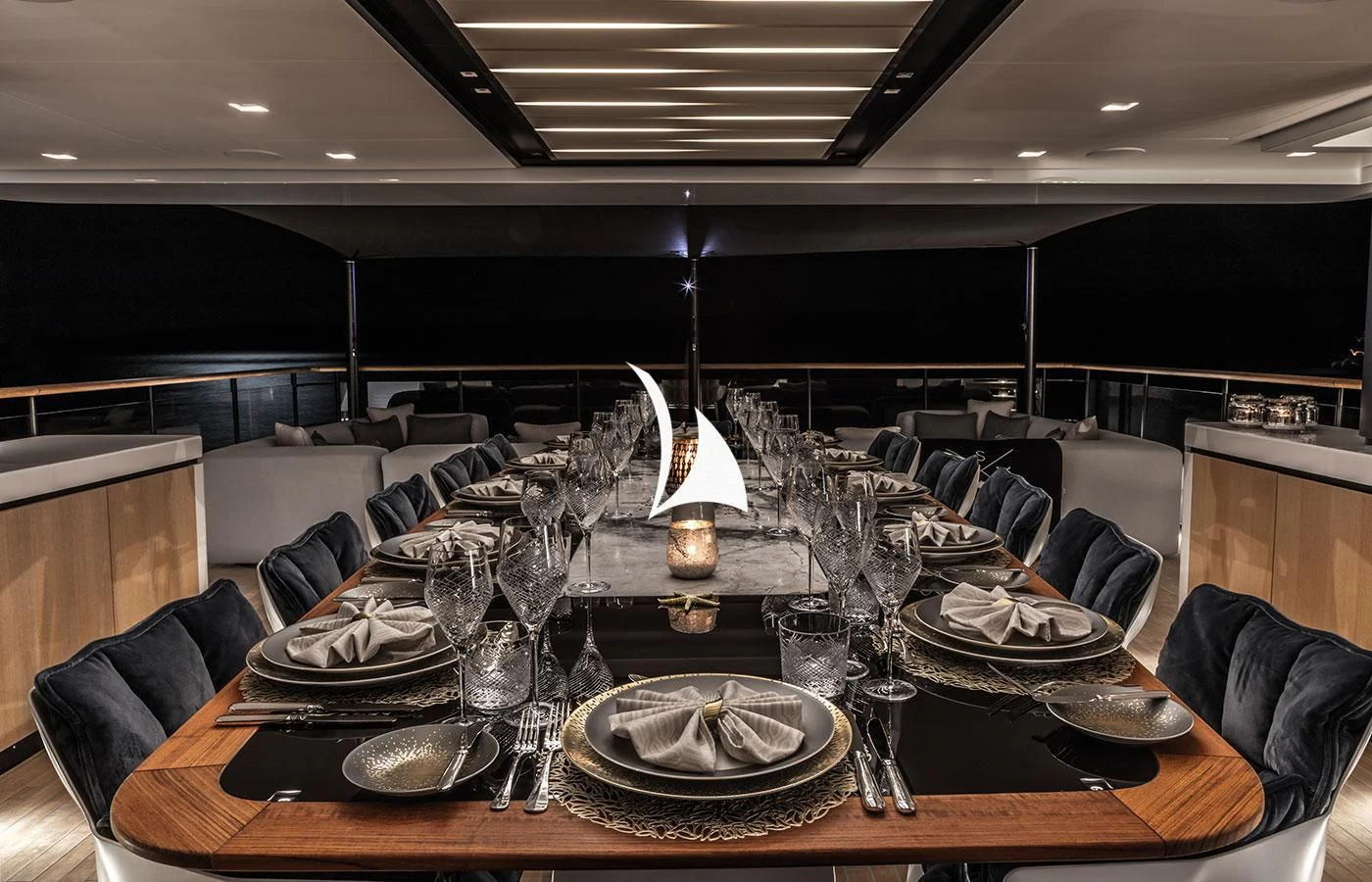 a large room with a table and chairs aboard SEVERIN°S Yacht for Charter