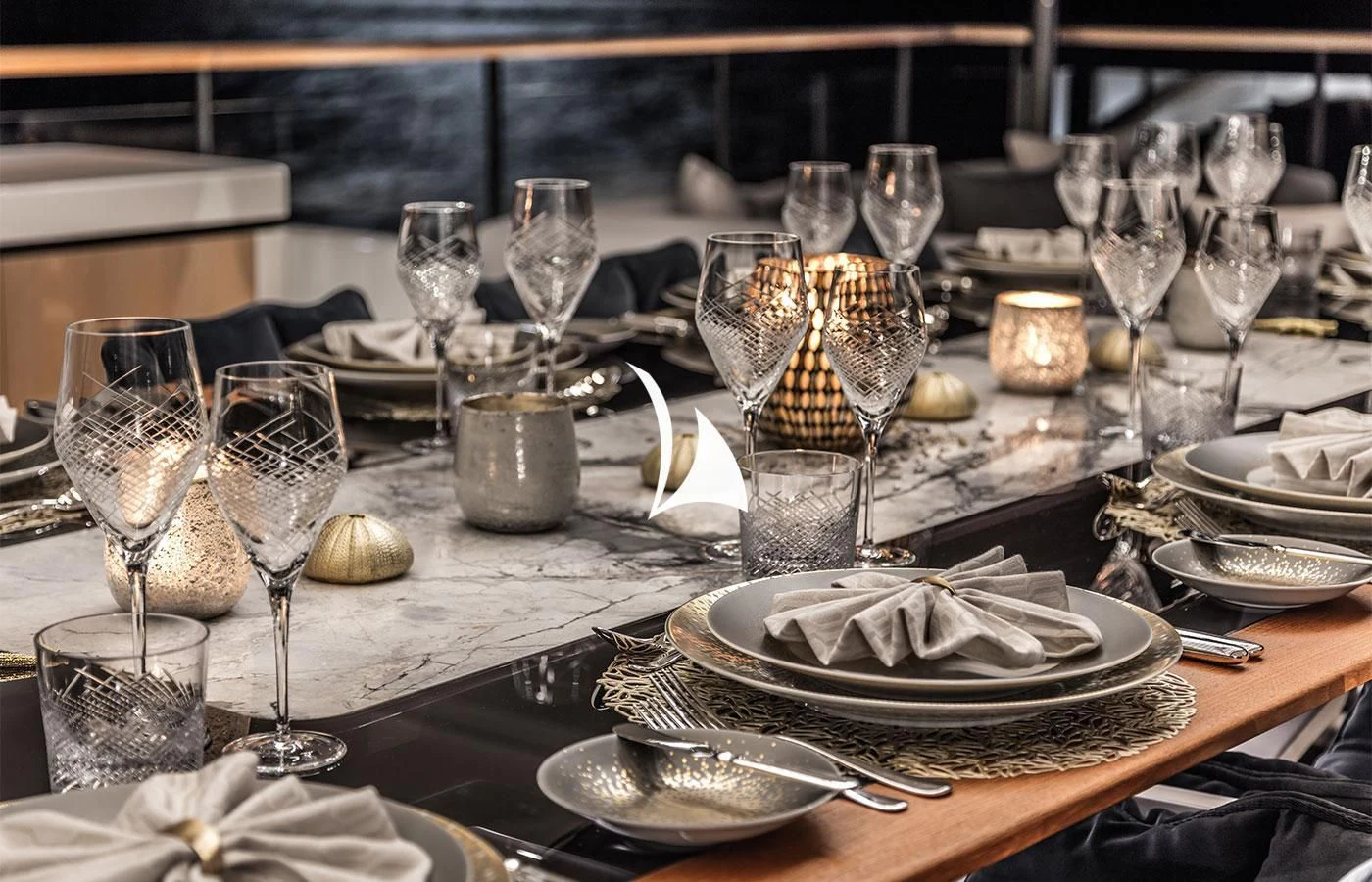 a table with many glasses and plates aboard SEVERIN°S Yacht for Charter