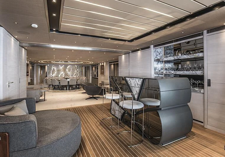 a large room with chairs and a table aboard SEVERIN°S Yacht for Charter