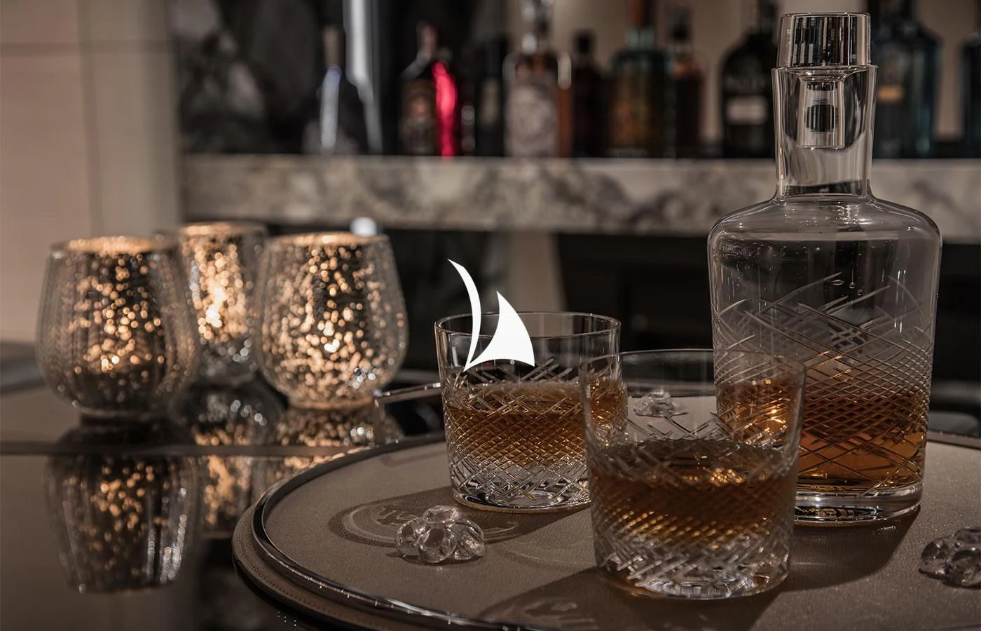 a group of glasses with liquid in them on a table aboard SEVERIN°S Yacht for Charter