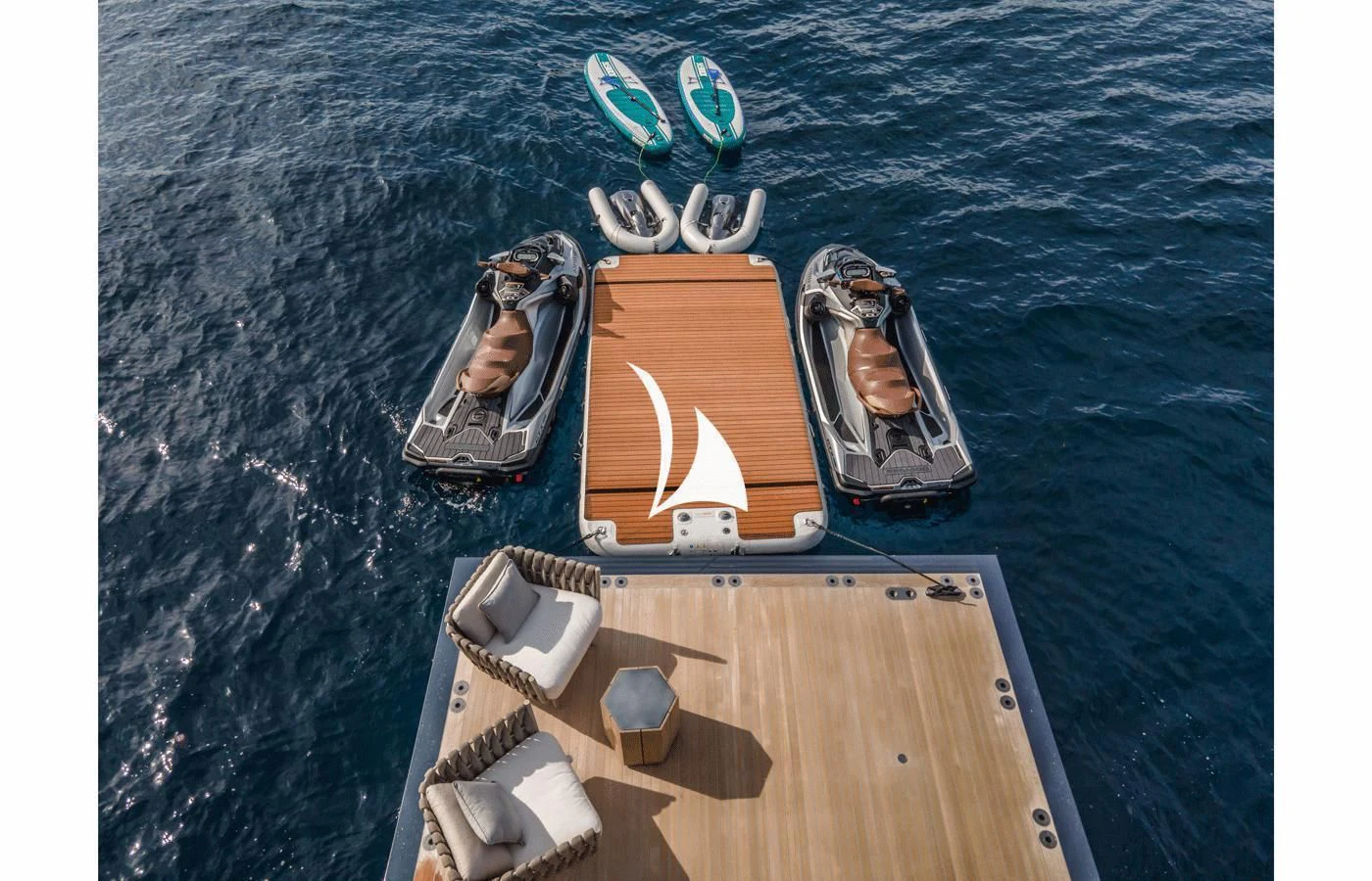 a group of sunglasses on a wooden table aboard SEVERIN°S Yacht for Charter