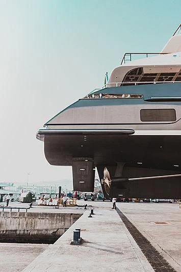 a large boat docked at a pier aboard SEVERIN°S Yacht for Charter