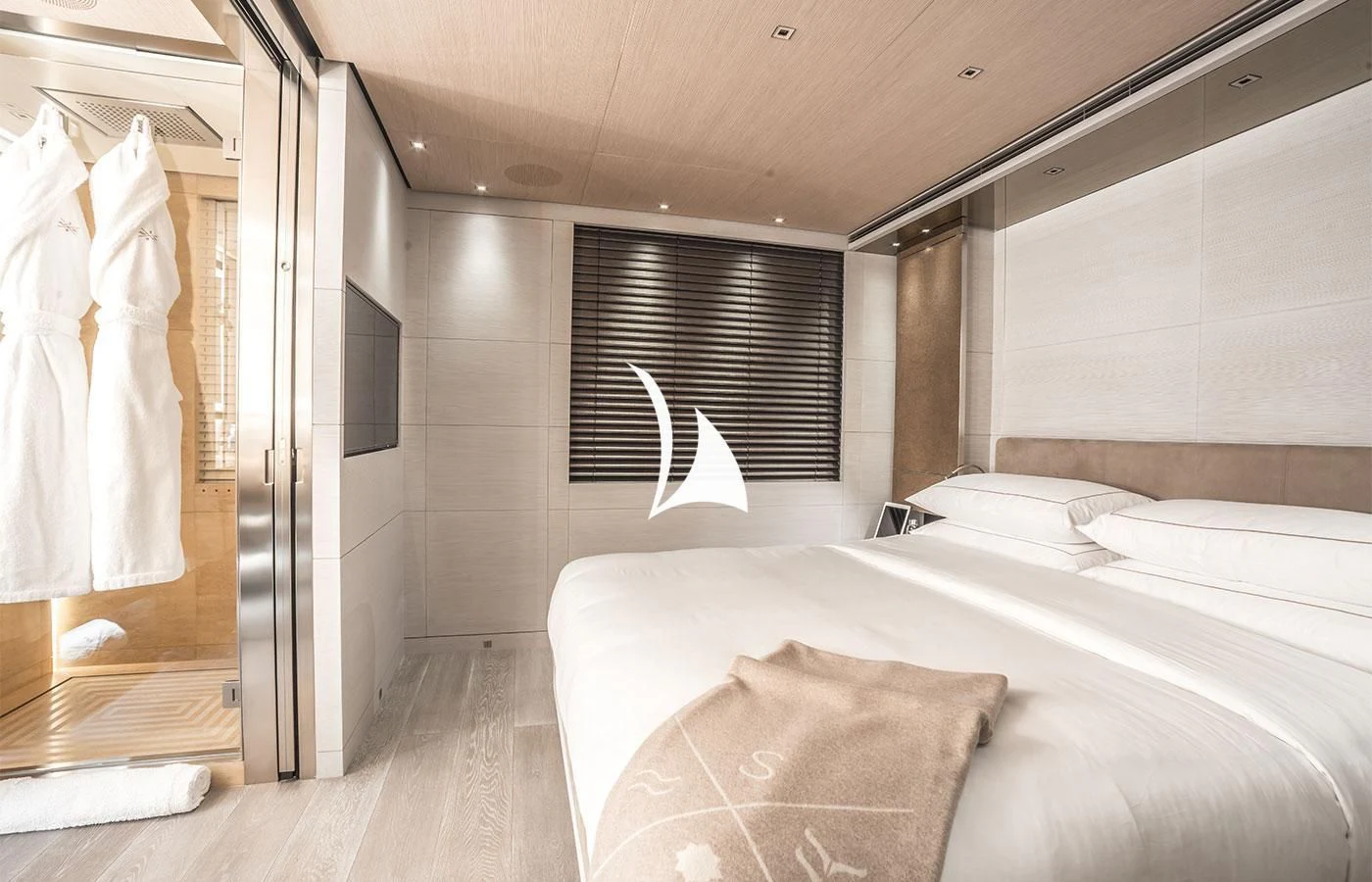 a bedroom with a bed and a window aboard SEVERIN°S Yacht for Charter