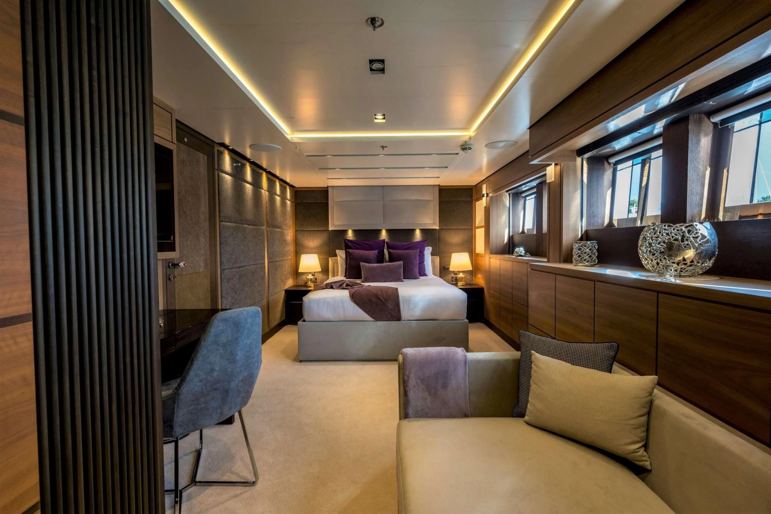 a room with a couch and a table aboard NAVIS ONE Yacht for Charter