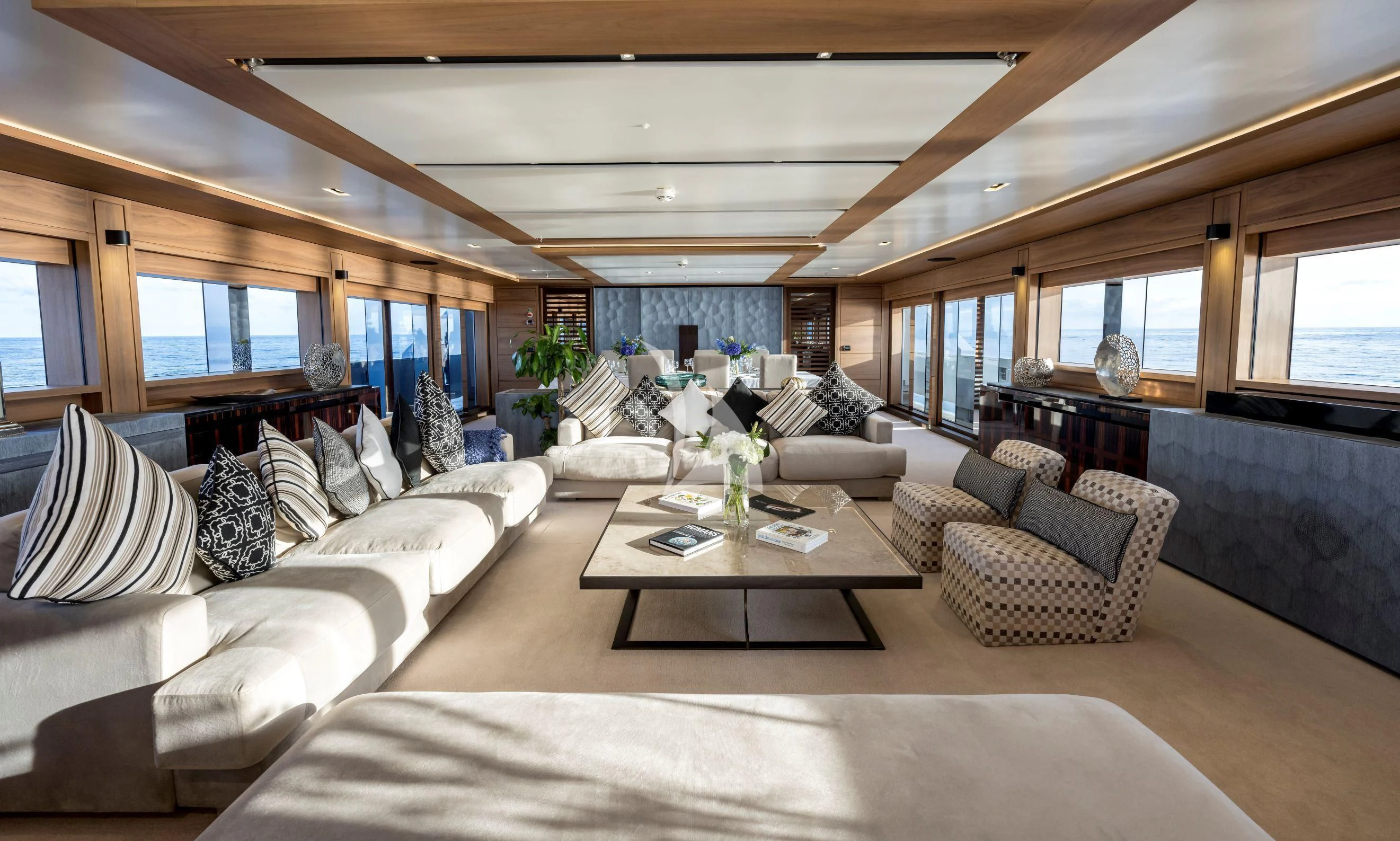 a living room with a large window aboard NAVIS ONE Yacht for Charter