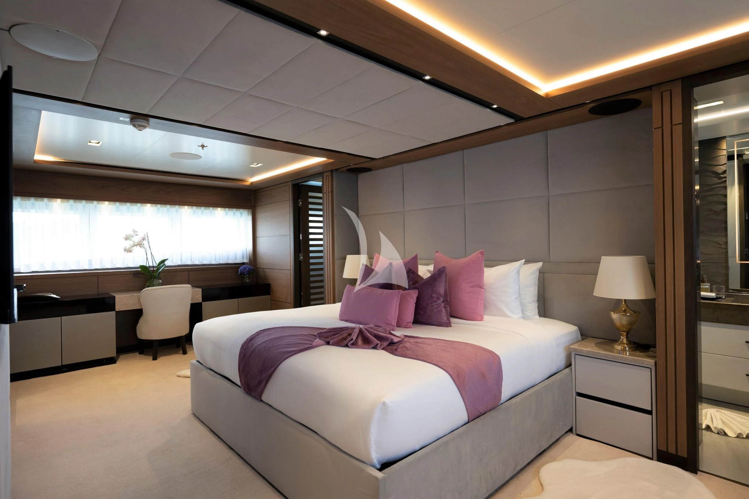 a large bed in a room aboard NAVIS ONE Yacht for Charter