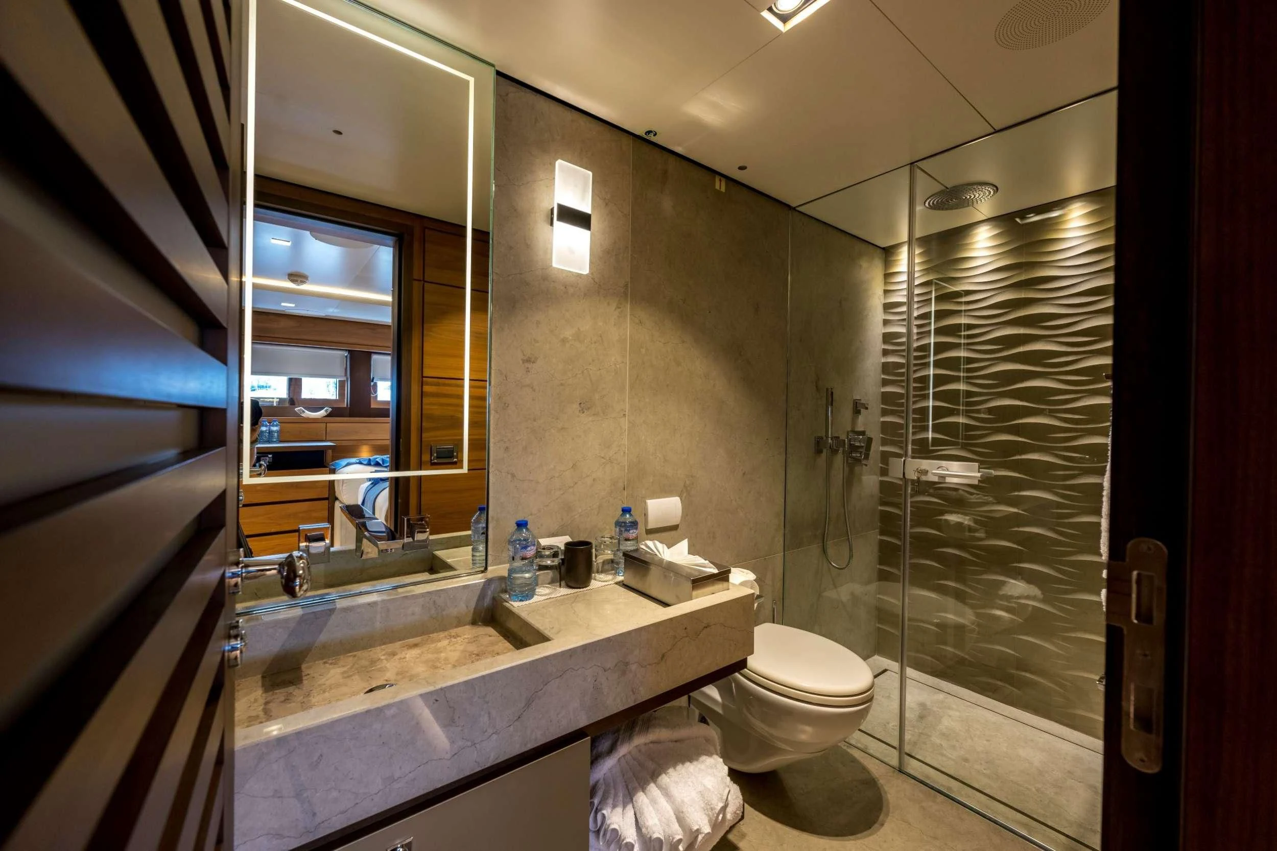 a bathroom with a glass shower aboard NAVIS ONE Yacht for Charter
