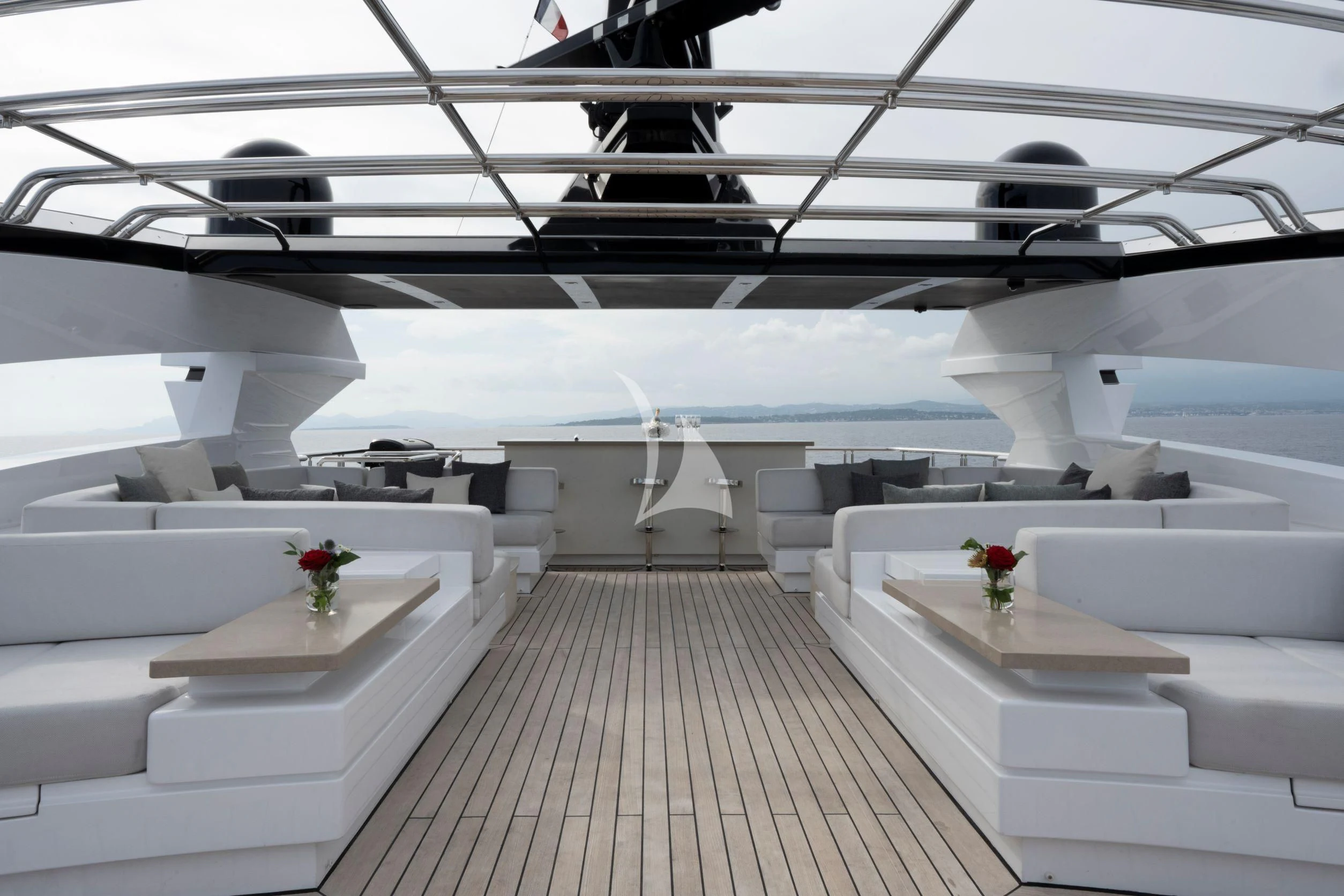 a room with white walls and white furniture aboard NAVIS ONE Yacht for Charter