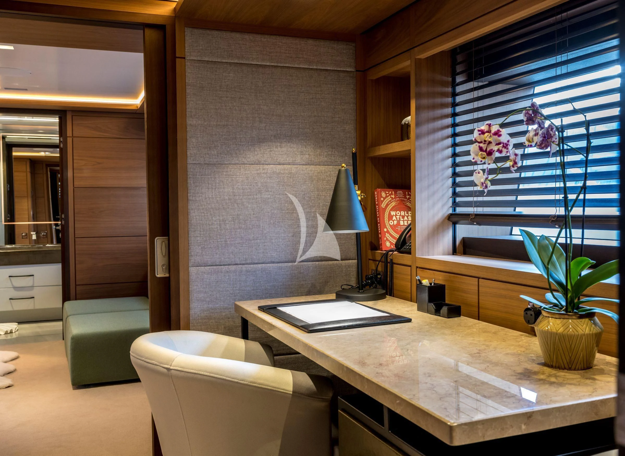 a room with a table and chairs aboard NAVIS ONE Yacht for Charter