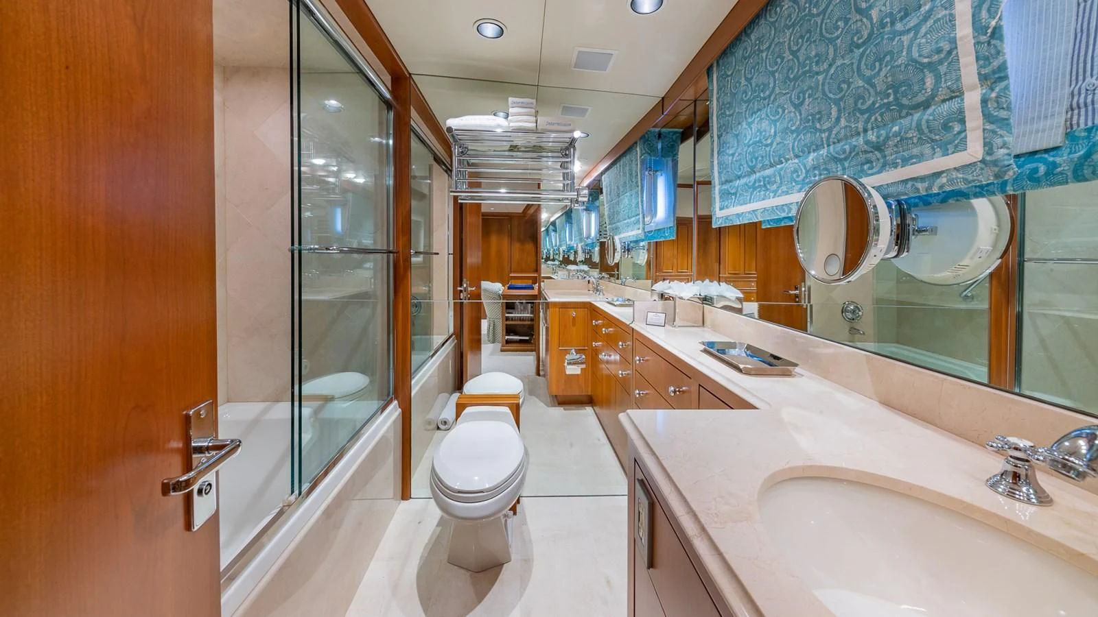 a bathroom with a glass shower aboard SEAQUEL Yacht for Sale