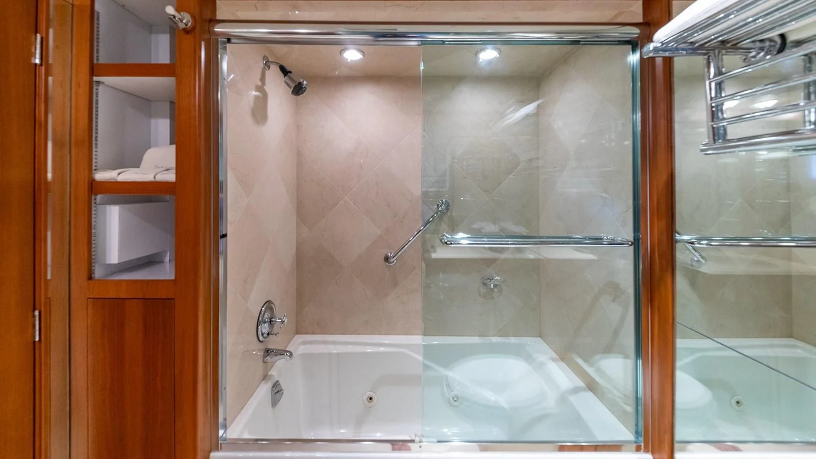a bathroom with a glass shower aboard SEAQUEL Yacht for Sale