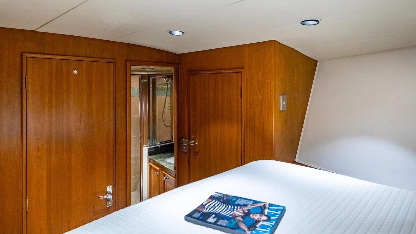 a large wooden closet in a room aboard SEAQUEL Yacht for Sale