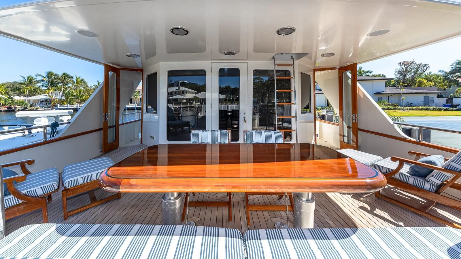 a room with a table and chairs aboard SEAQUEL Yacht for Sale