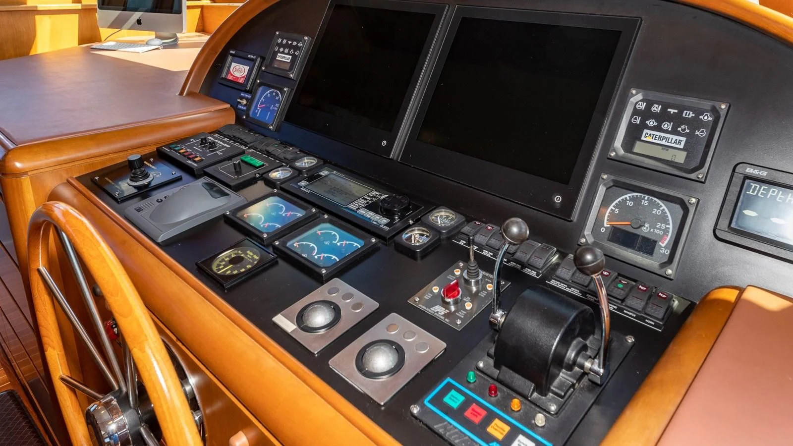 a black console with a black screen and buttons aboard SEAQUEL Yacht for Sale