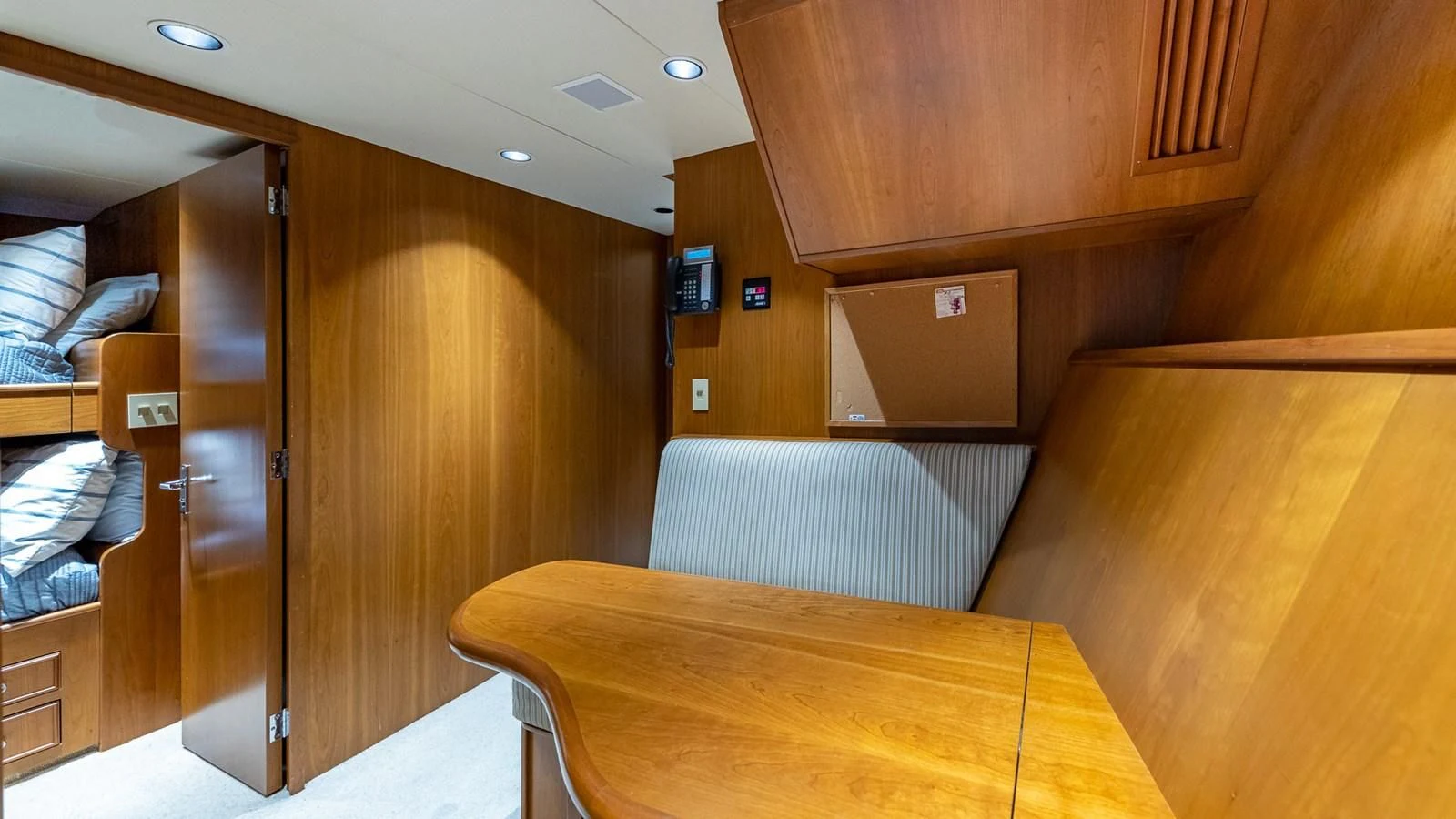 a room with a table and chairs aboard SEAQUEL Yacht for Sale