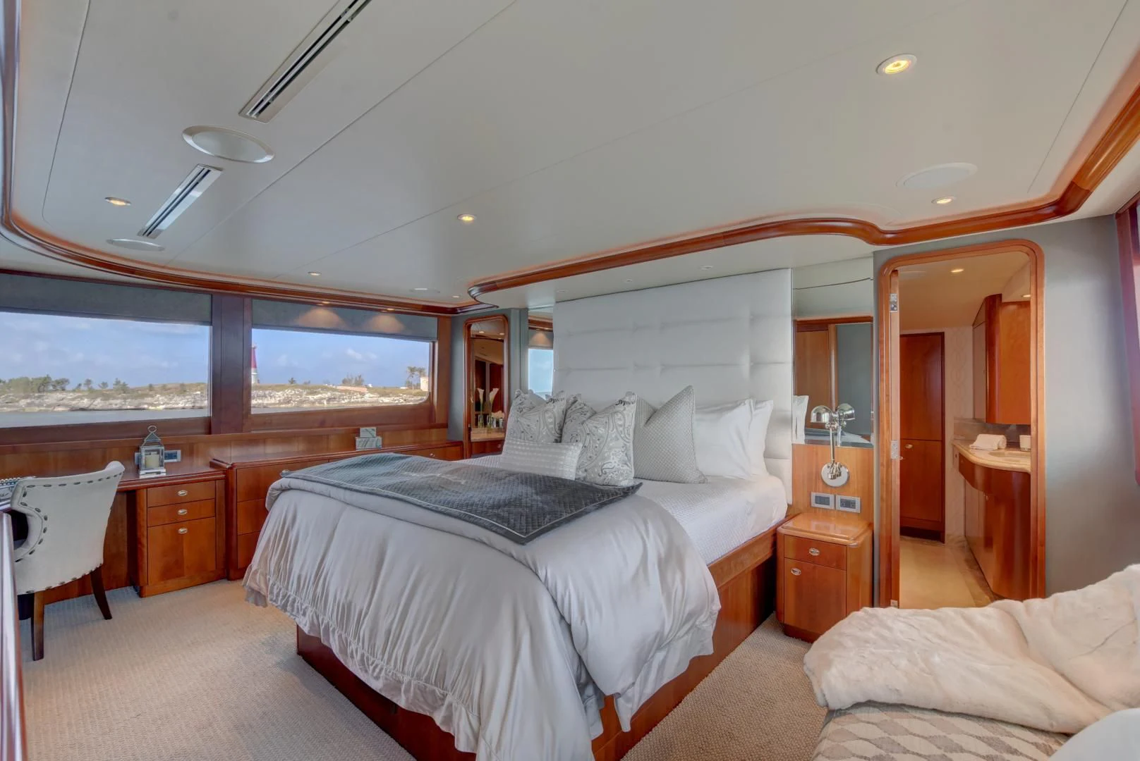 a room with a bed and a window aboard GOOD TIMES Yacht for Sale