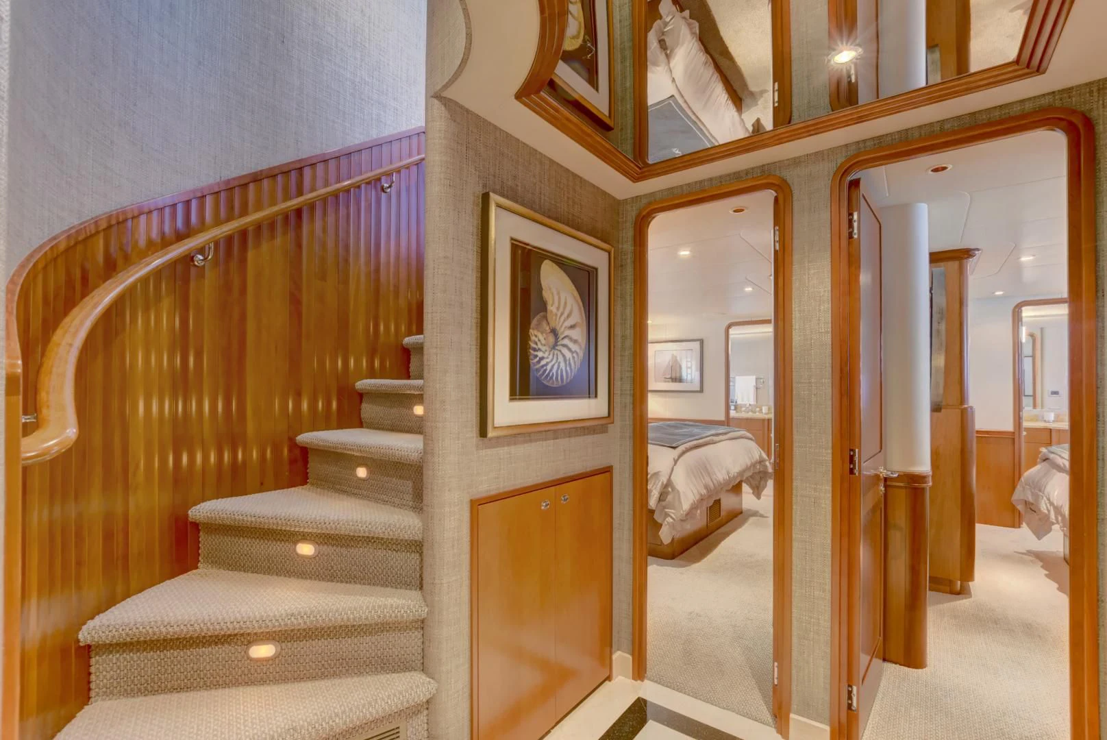 a room with a bed and a mirror aboard GOOD TIMES Yacht for Sale