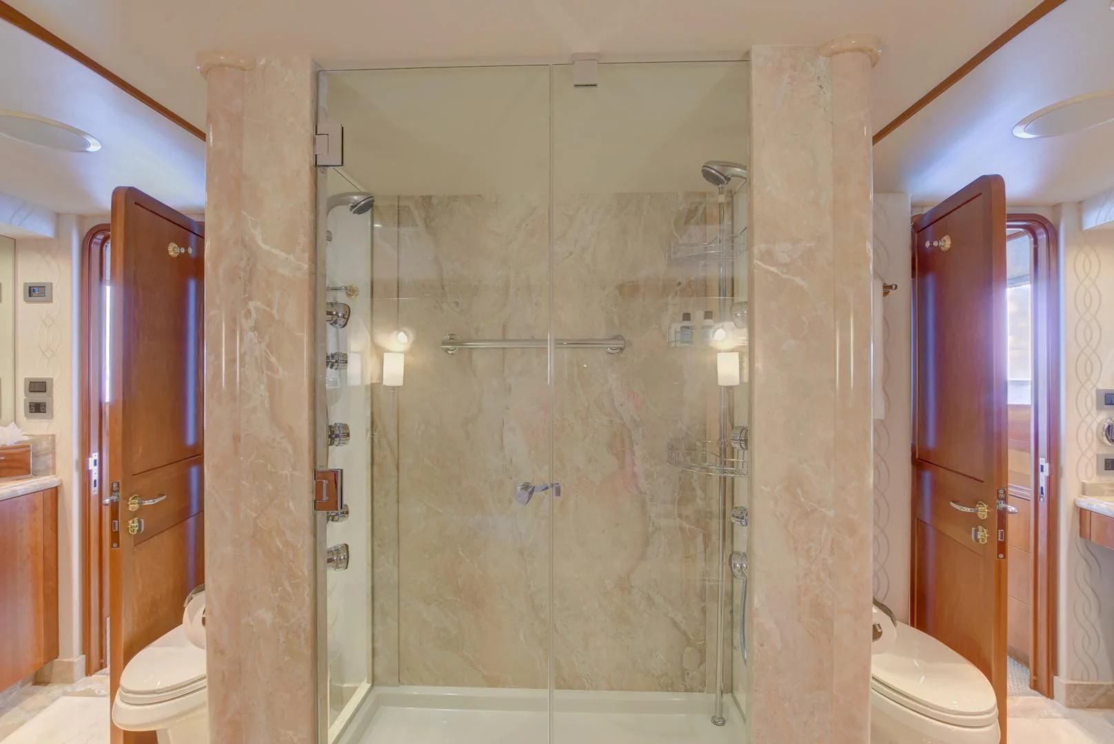 a bathroom with a glass shower aboard GOOD TIMES Yacht for Sale