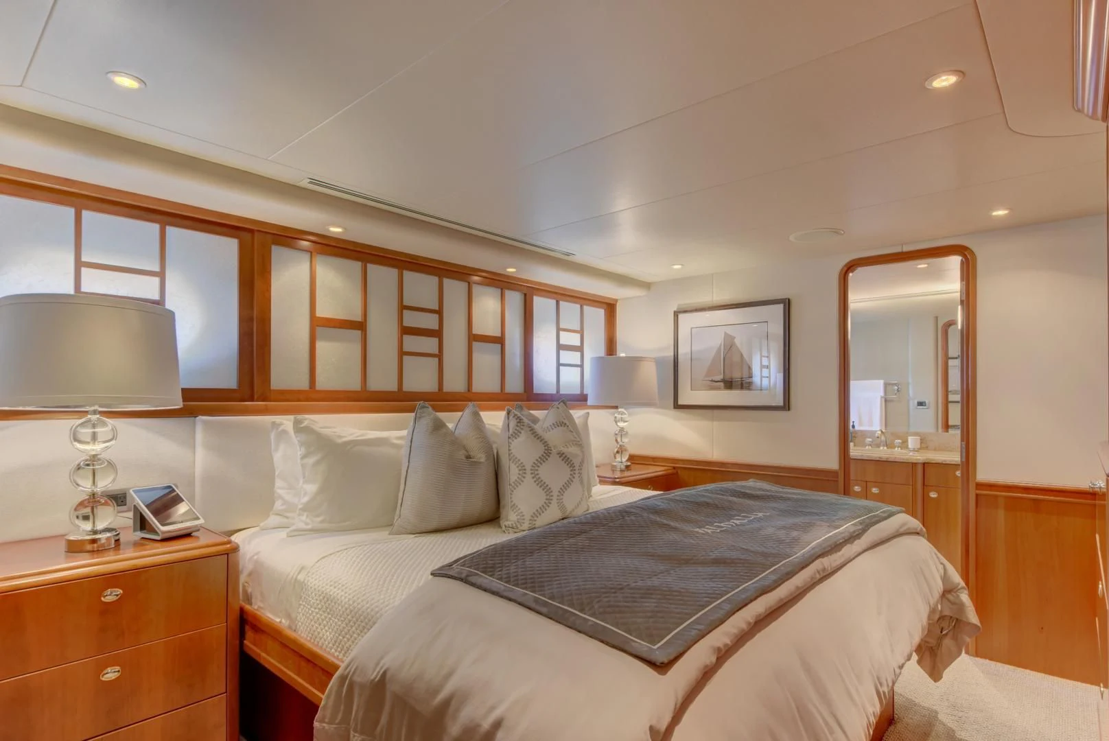 a bedroom with a bed and a desk aboard GOOD TIMES Yacht for Sale