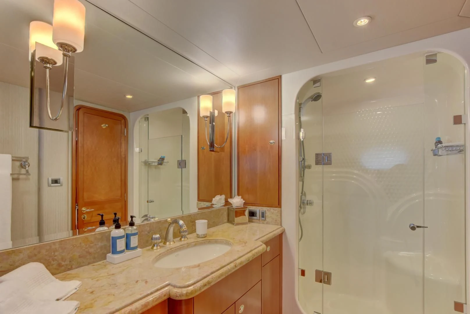 a bathroom with a large mirror aboard GOOD TIMES Yacht for Sale