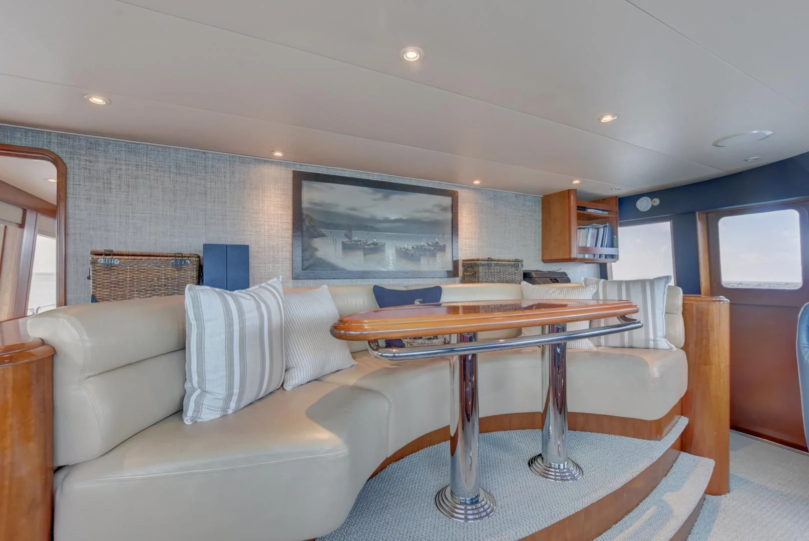 a living room with a couch and a table aboard GOOD TIMES Yacht for Sale