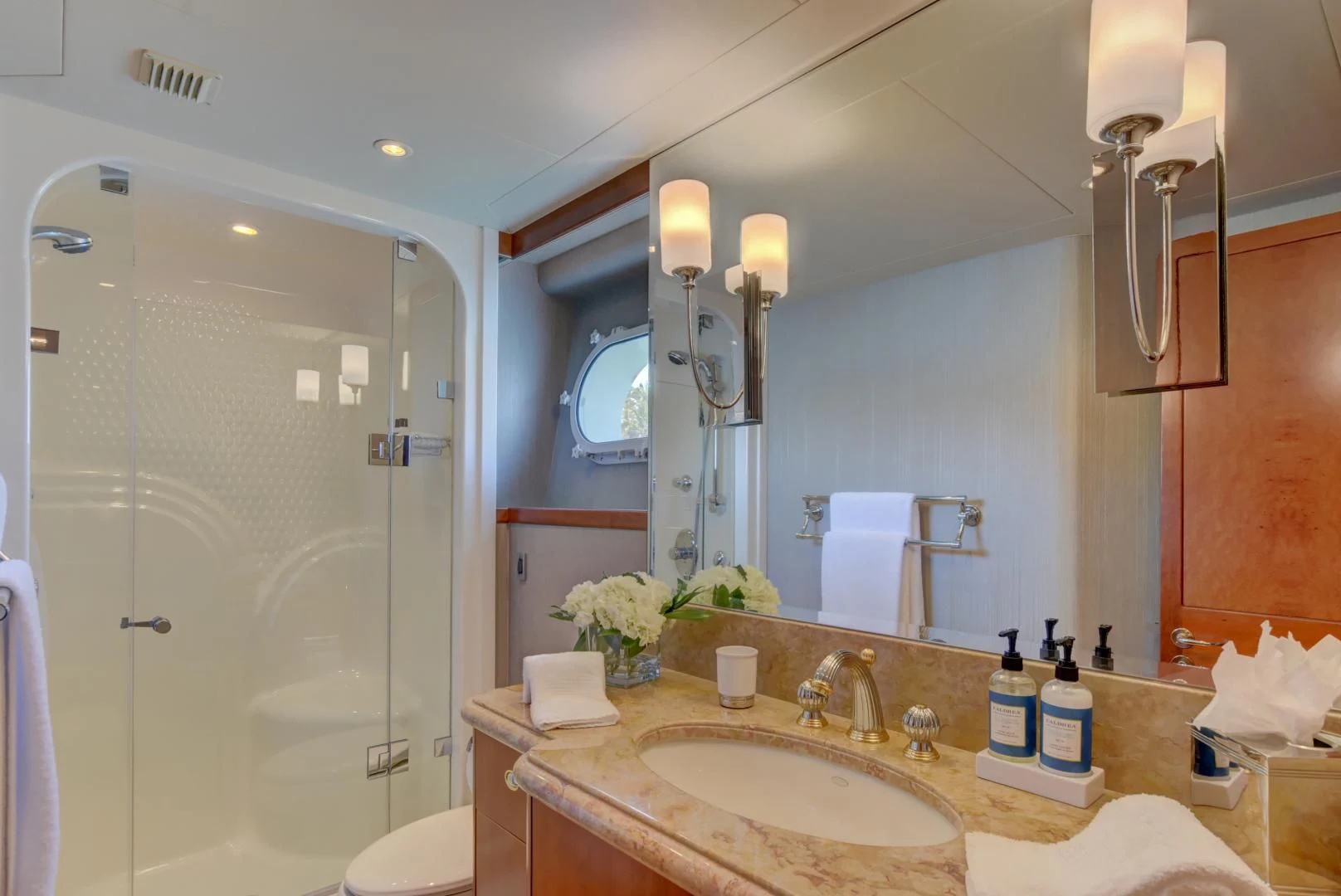 a bathroom with a large mirror aboard GOOD TIMES Yacht for Sale