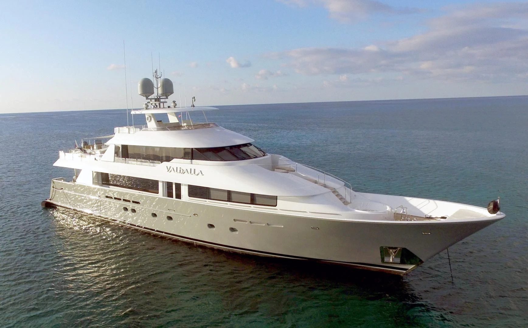 a white yacht in the water aboard GOOD TIMES Yacht for Sale