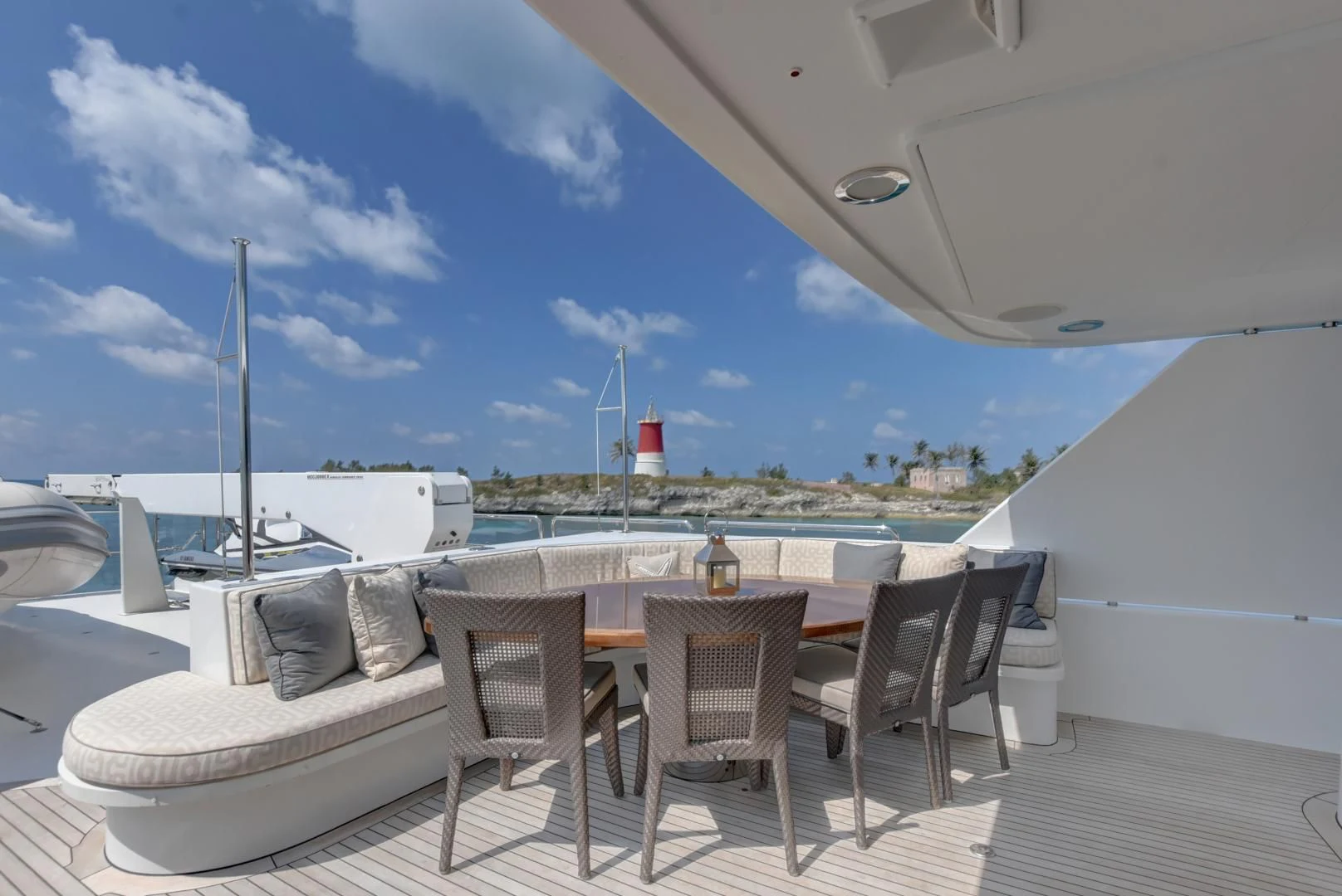 a table and chairs on a deck aboard GOOD TIMES Yacht for Sale