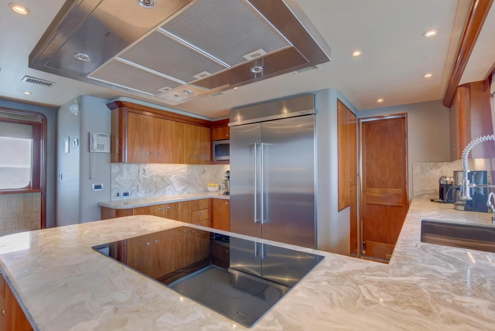 a kitchen with a large island aboard GOOD TIMES Yacht for Sale