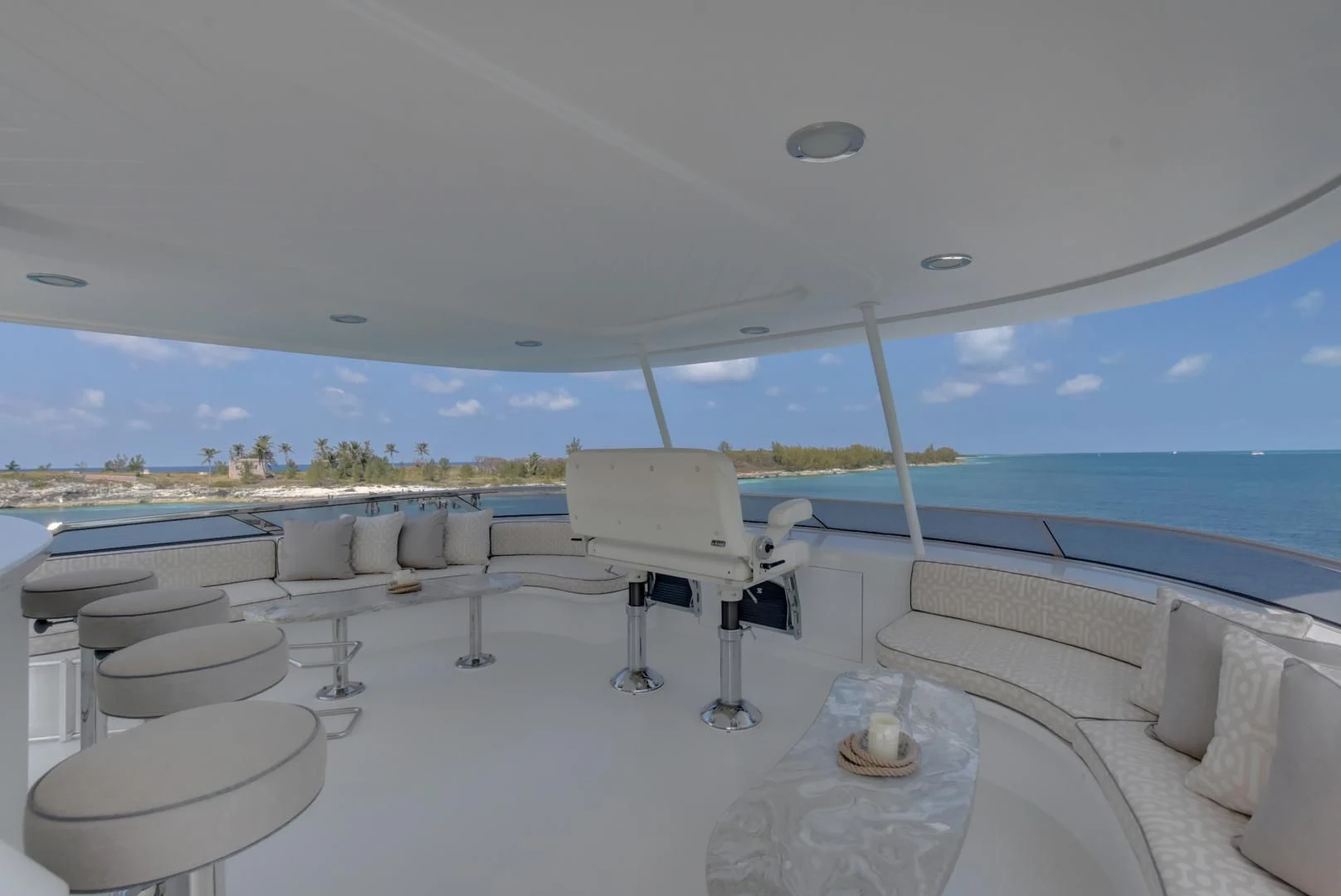 a room with a table chairs and a large body of water aboard GOOD TIMES Yacht for Sale