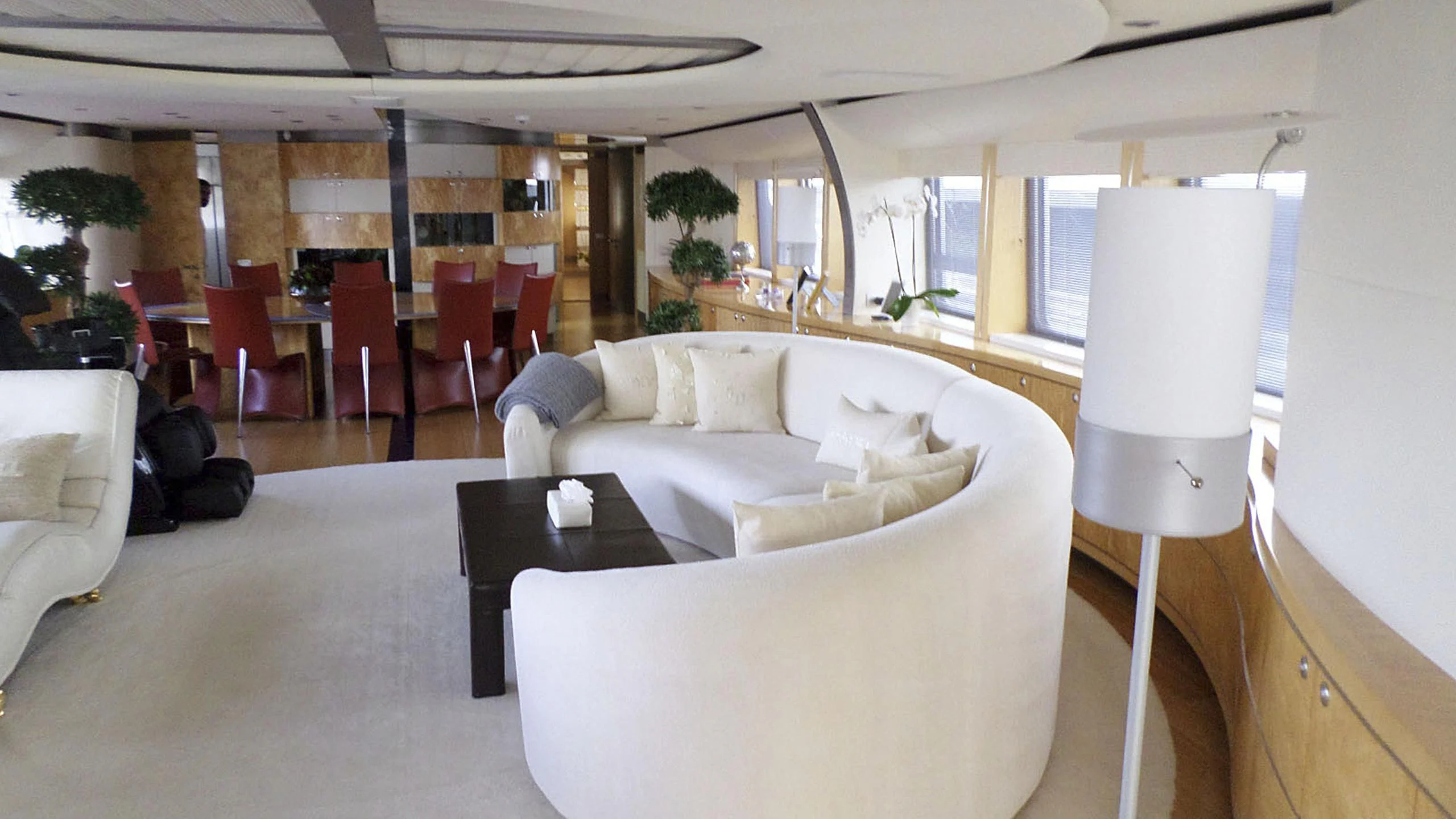 a living room with a white couch and a table aboard KING LOUIS Yacht for Sale