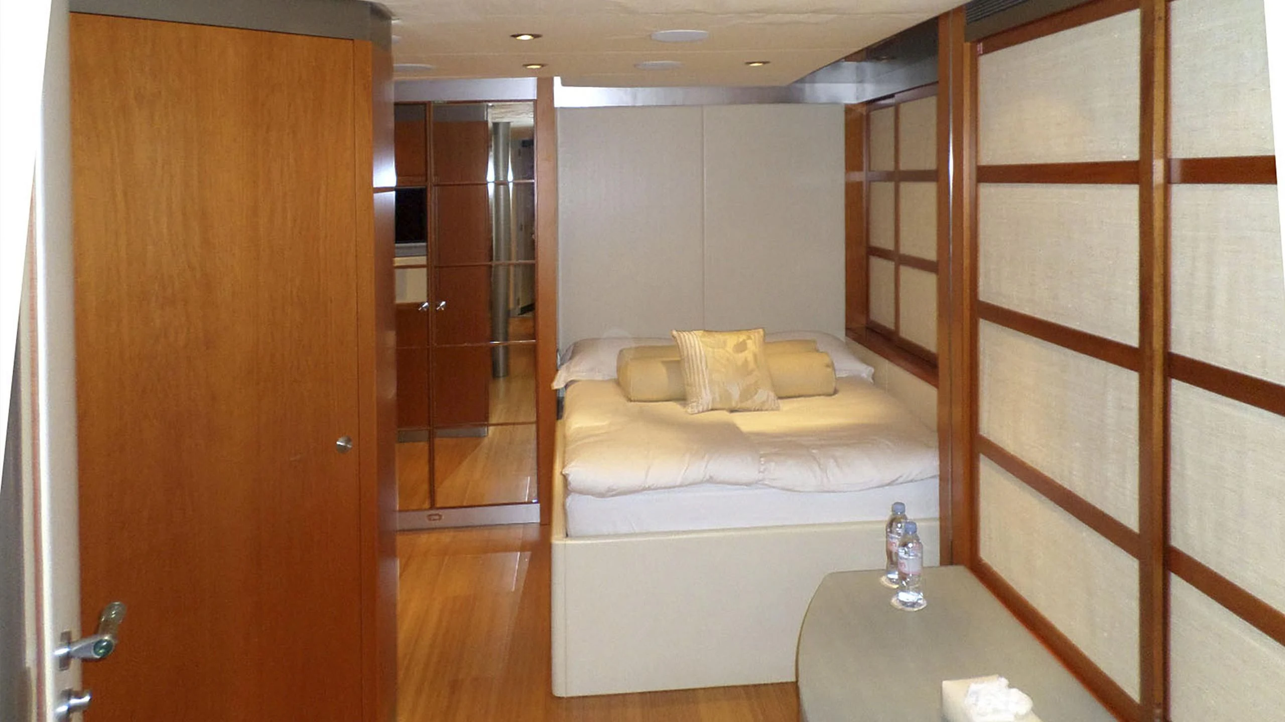 a room with a bed and a table aboard KING LOUIS Yacht for Sale