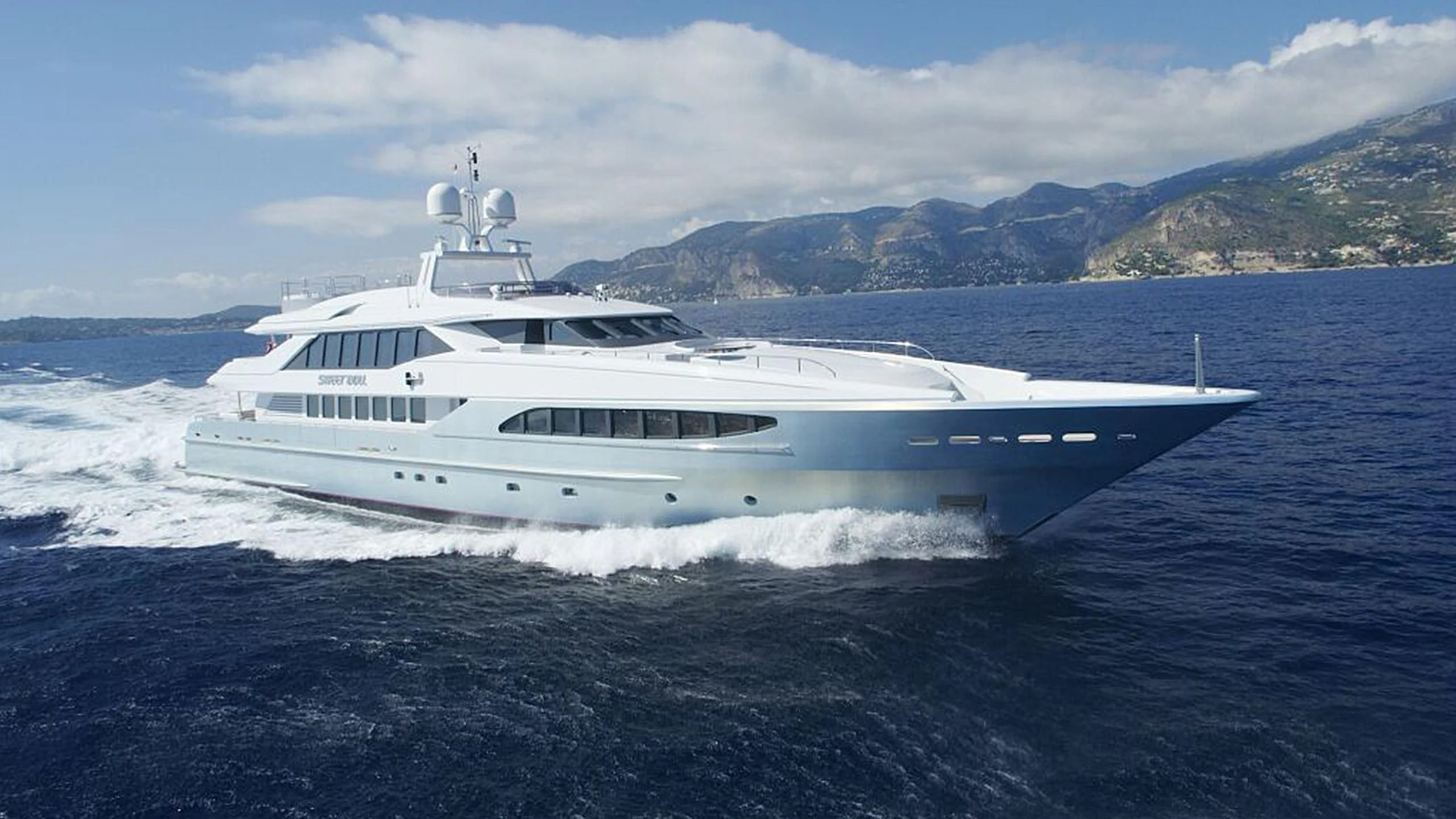 a white yacht on the water aboard KING LOUIS Yacht for Sale