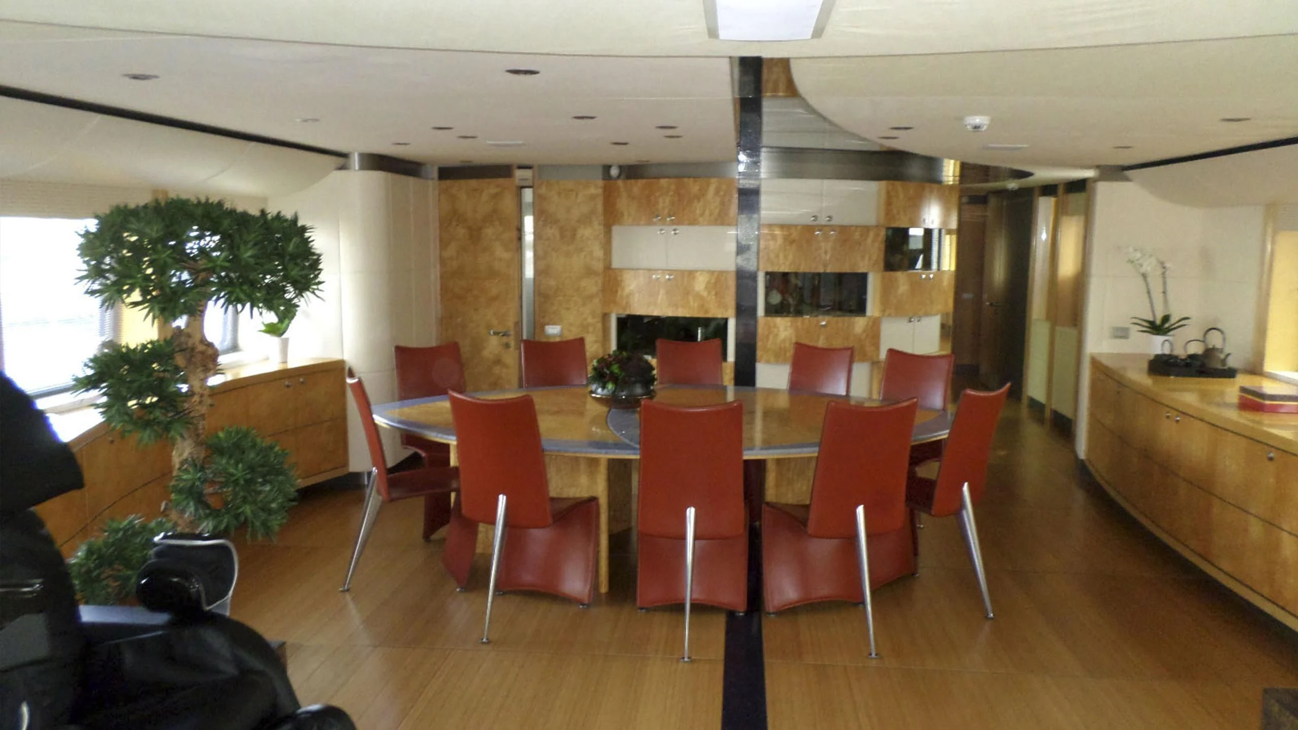 a large room with tables and chairs aboard KING LOUIS Yacht for Sale